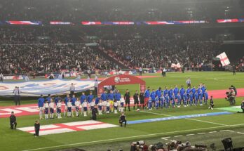 England and Italy's football teams line-up during the national anthems.