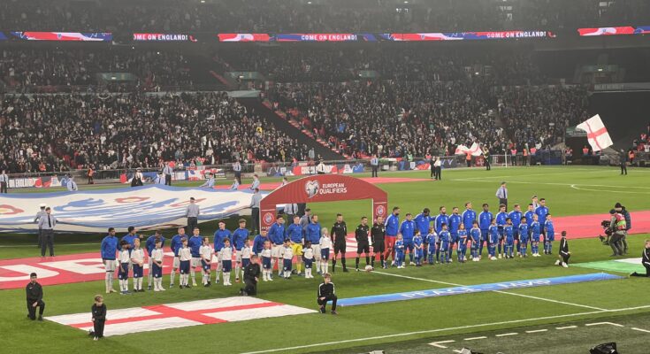 England and Italy's football teams line-up during the national anthems.