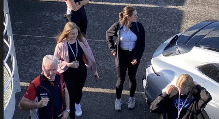 Girls On Track UK members at a Porsche event about to get in a car for a test run.