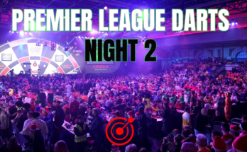 A darts stage with a large crowd. A grahpic reads 'Premier League Darts Night 2" in black and white text