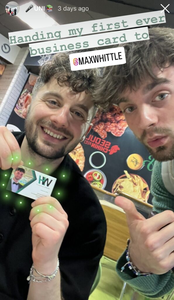 A screenshot of an Instagram story which is selfie of Will Hewlett and Max Whittle. Max is holding a business card which was given to him by Will.