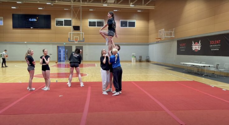 Cheer team practice a lift