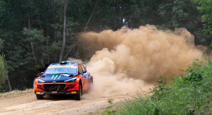 WRC car driving round on one of the dirt tracks