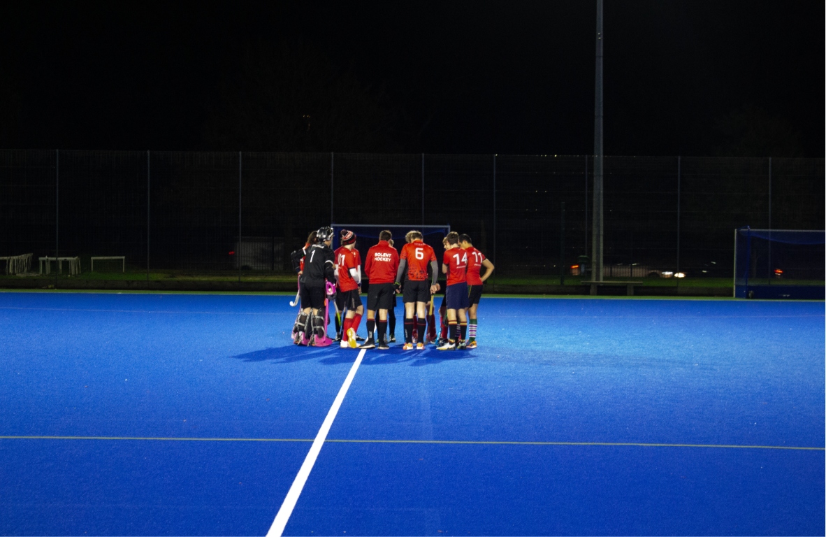 solent mens haockey team in huddle before the game starts