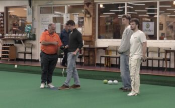 Atherley Bowls showing young students how to play the sport.