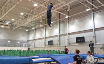 A man mid-air after jumping on a trampoline