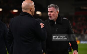 LIVERPOOL, ENGLAND - MARCH 11: Arne Slot, Manger of Liverpool, shakes hands with Jamie Carragher, former Liverpool player and TV pundit for Amazon Prime prior to the UEFA Champions League 2024/25 Round of 16 Second Leg match between Liverpool FC and Paris Saint-Germain at Anfield on March 11, 2025 in Liverpool, England. (Photo by Liverpool FC/Liverpool FC via Getty Images)