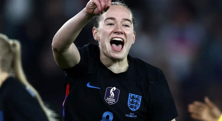 Football player celebrating goal in a match.