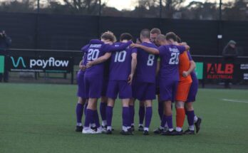 AFC Stoneham players huddled together before kick-off