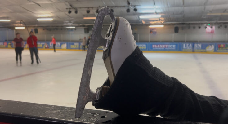 An ice skating boot on a ledge