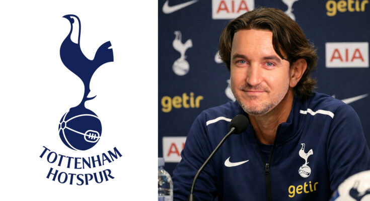 Tottenham Hotspur manager Thomas Frank sat at a press conference next to an image of the club badge.
