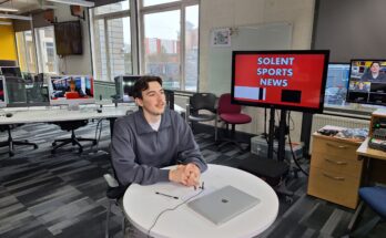 Rivan Corbett sat at the desk