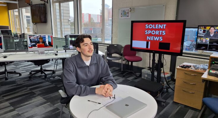 Rivan Corbett sat at the desk