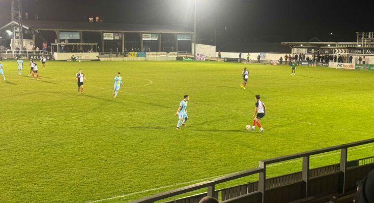 Maidenhead United attacker with ball being approached by Ebbsfleet United defender