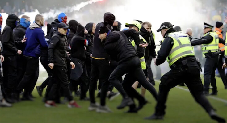 Police are trying to contain Rangers and Celtic fans