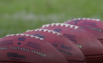 NFL balls in training action.