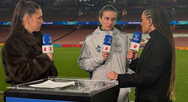 Arsenal manager Renee Slegers stands with Fara Williams and Alex Scott, holding ESPN and Disney+ mics pitch side.