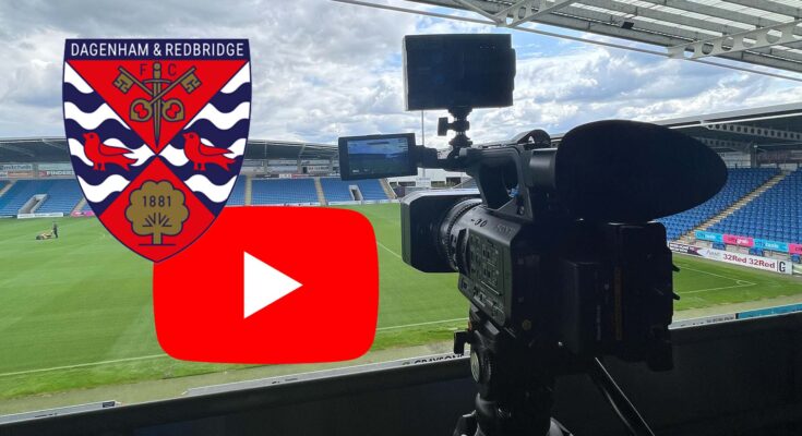 Camera pointing onto pitch with YouTube logo and Dagenham and Redbridge badge.
