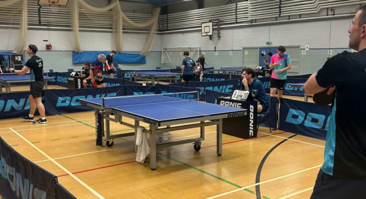 Table tennis courts during play in the veterans tournament
