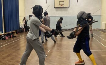Two fencers taking part in historical fencing