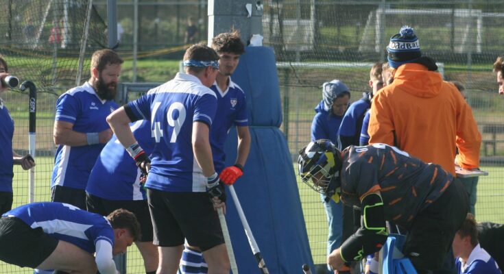Hockey players huddled in a circle