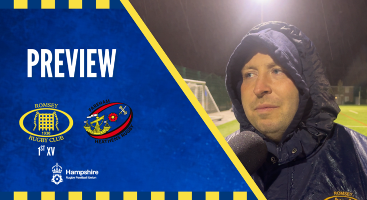 Rugby manager being interviewed with rugby club logos