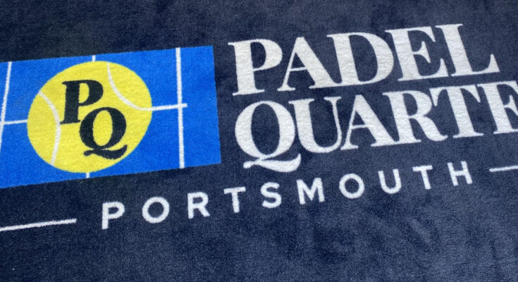 A welcome mat which says 'Padel Quarter'.